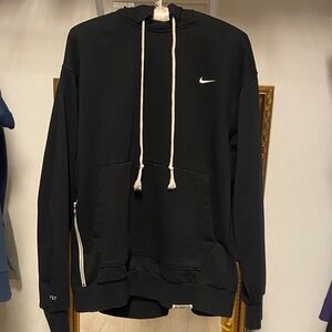 Nike Black Men's Hoodie with off white accents and one zipper pocket on side.